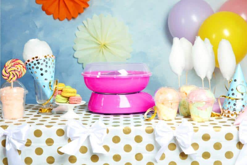table with cotton candy, snow cones, balloons and party streamers - Summer Carnival Party Idea