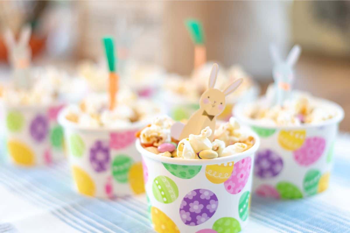 Colorful cups filled with popcorn and Easter candy